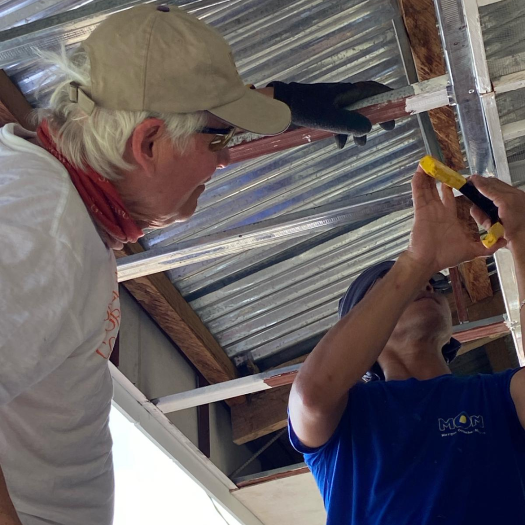 Fastening soffits on school in Philippines
