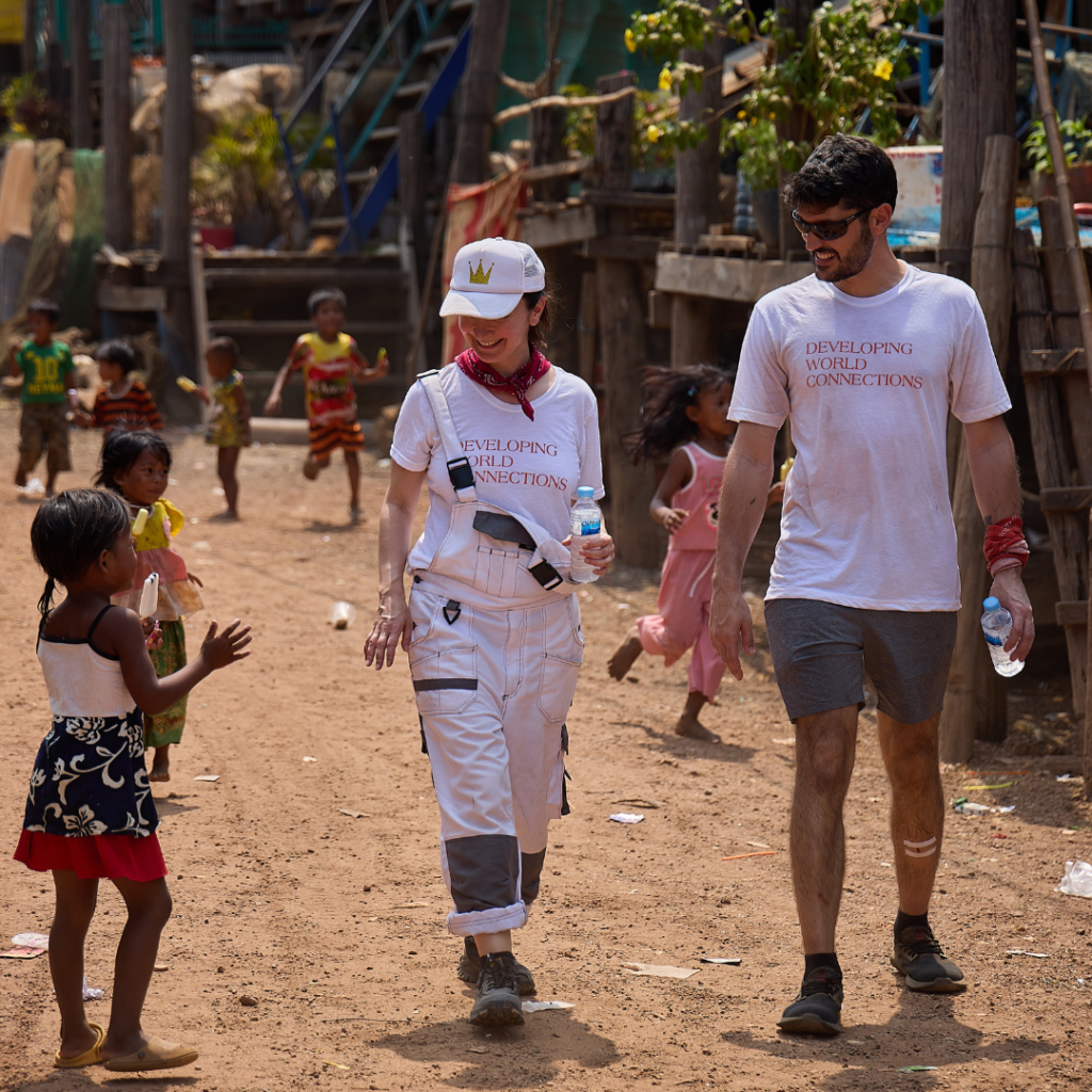 DWC whiteshirt volunteers with children Cambodia