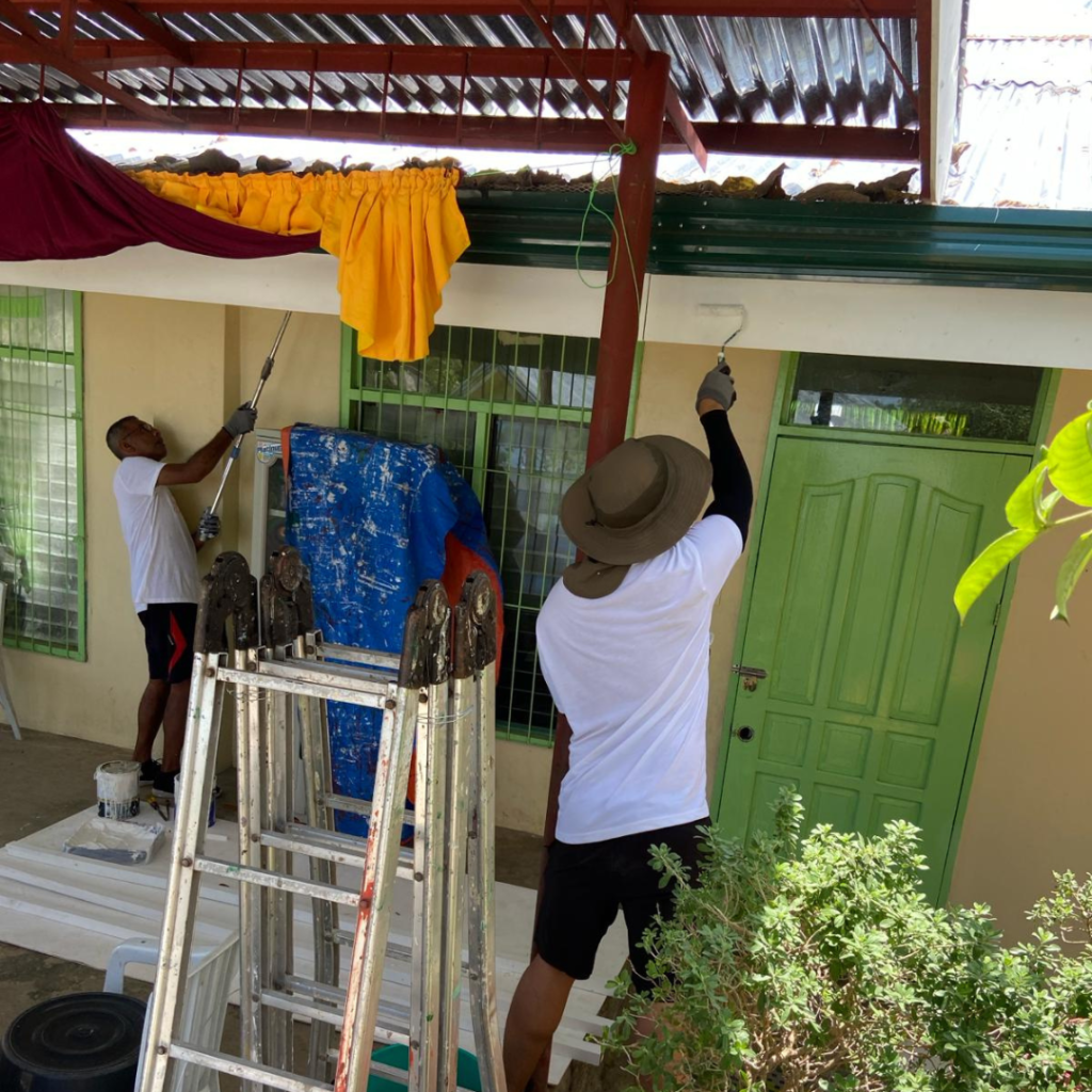 Painting soffits on school in Philippines