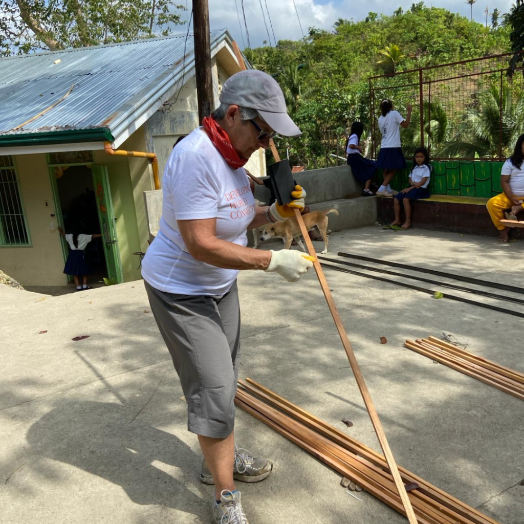 DWC volunteer sanding beam Philippines