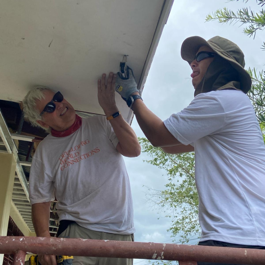 DWC volunteers installing gutters for school in Philippines