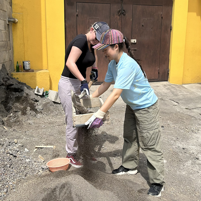 Volunteers sifting sand Guatemala