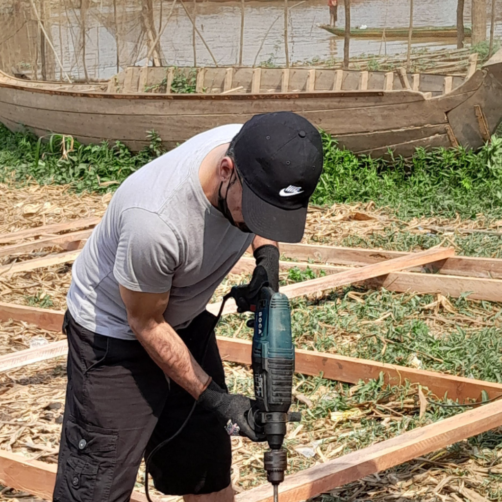 Salesforce volunteer with drill Cambodia