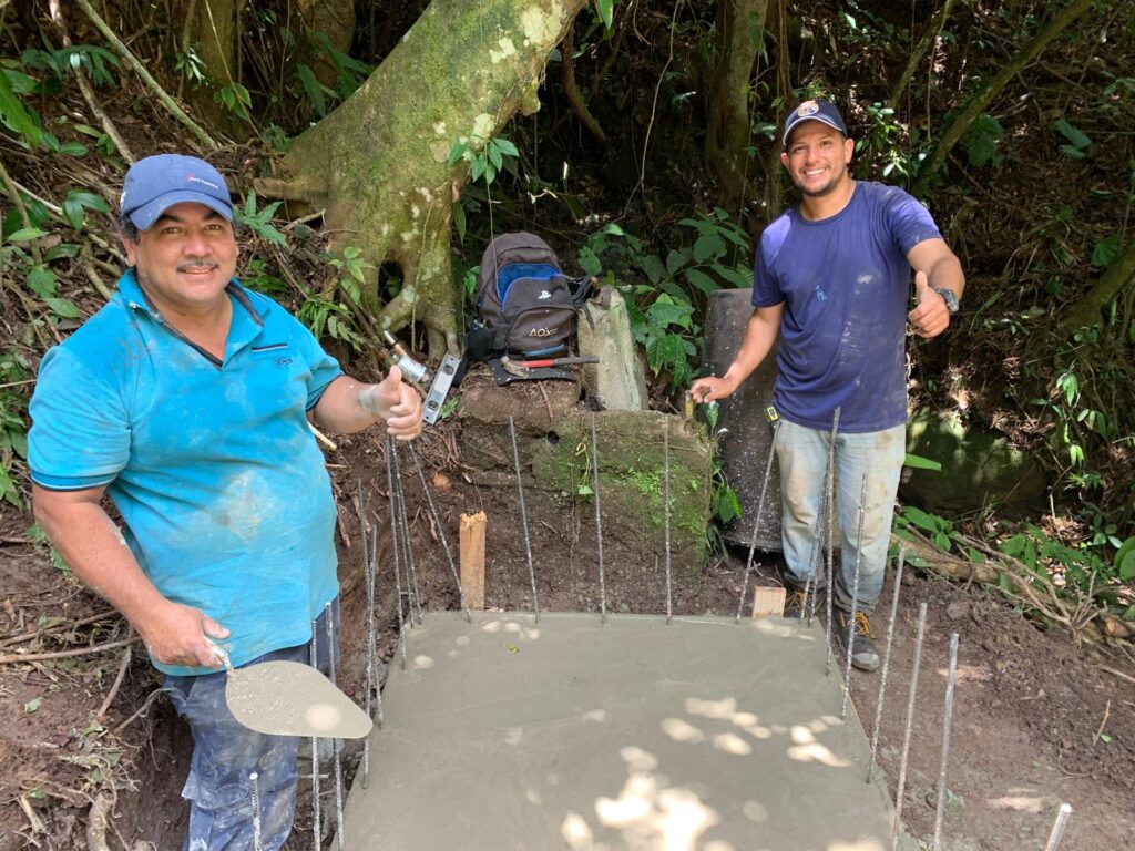 Volunteer with local tradesperson at concrete slab Costa Rica