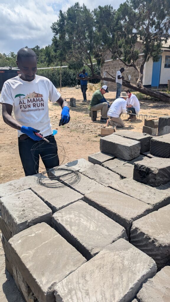 Local tradesperson at brick pile Kenya