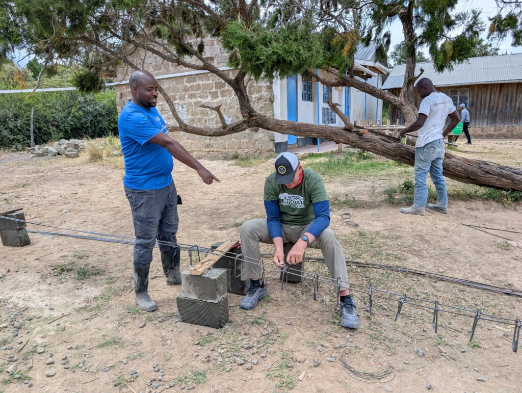 Volunteer working with rebar Kenya