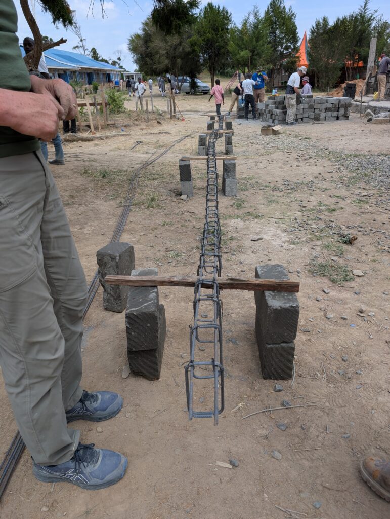 Volunteer working with rebar Kenya