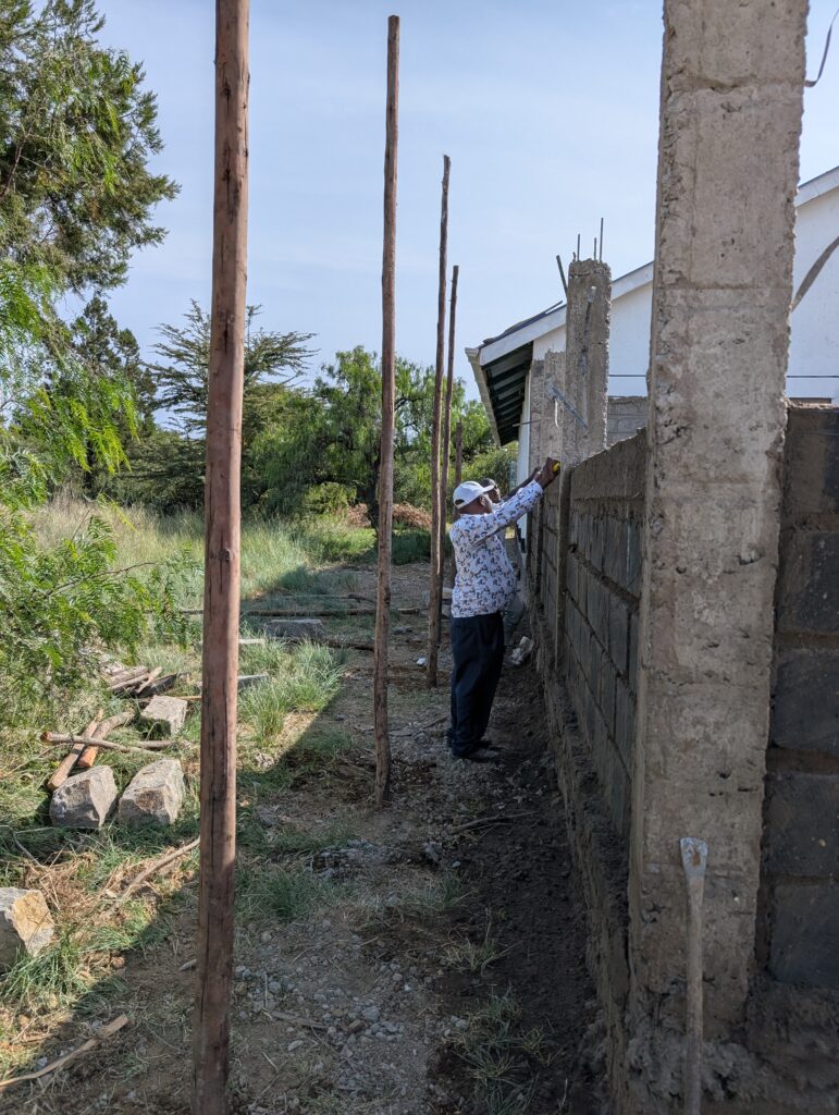 Checking brick walls for level Kenya