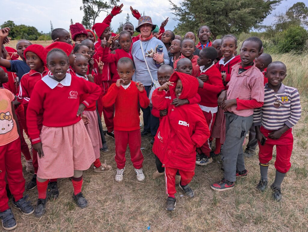 School children posing with volunteer Kenya