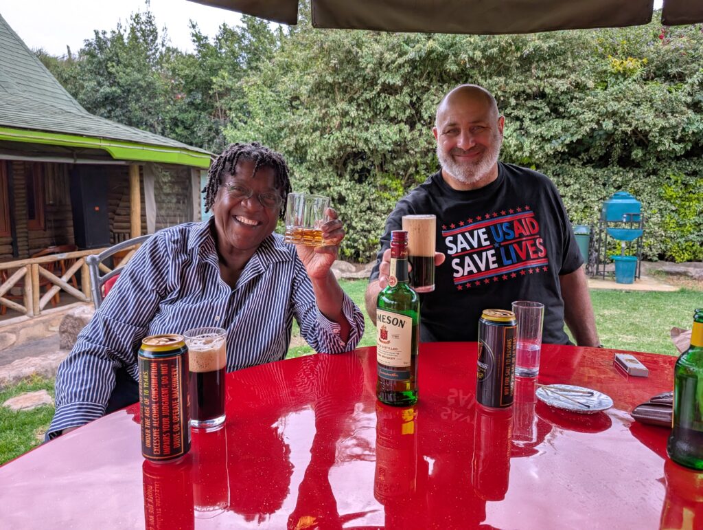 Volunteer drinking beer and scotch