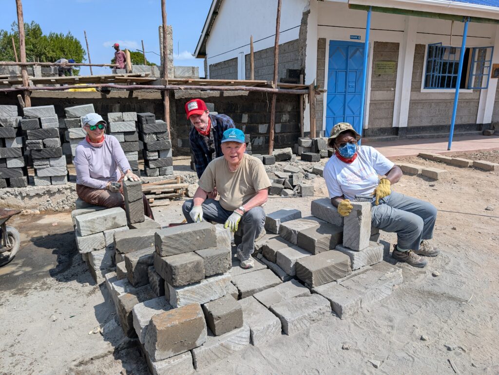 Volunteers with bricks Kenya