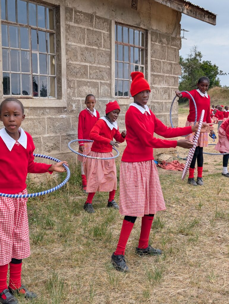 School kids playing with Houla hoops Kenya