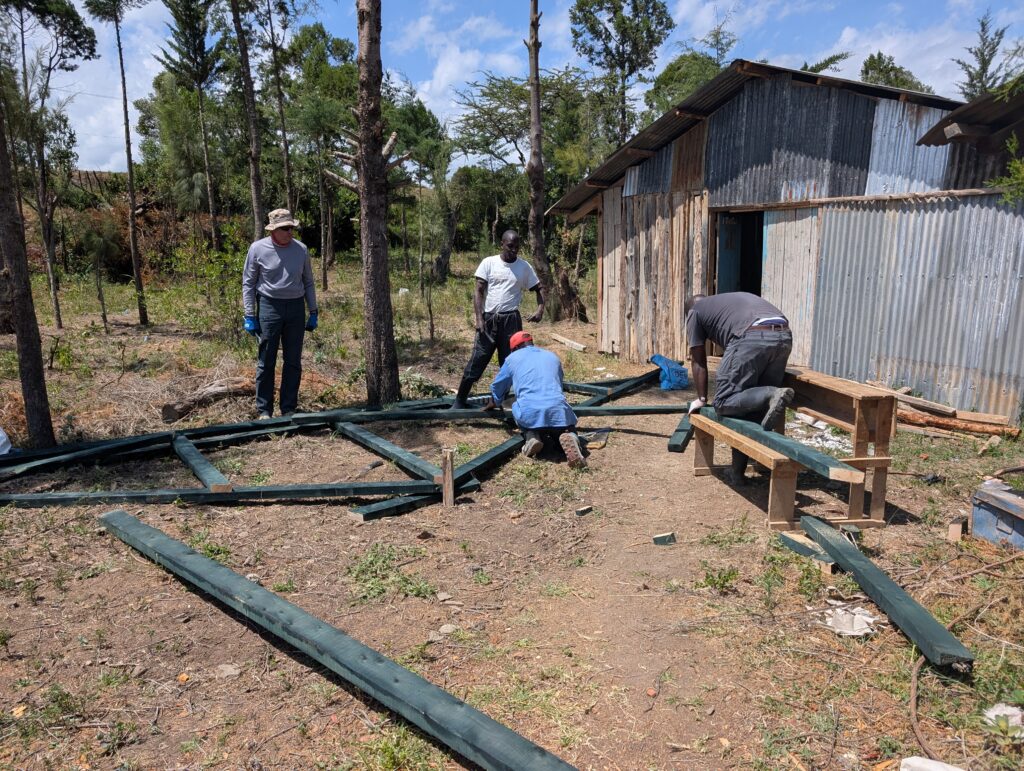 Pulling nails from boards Kenya
