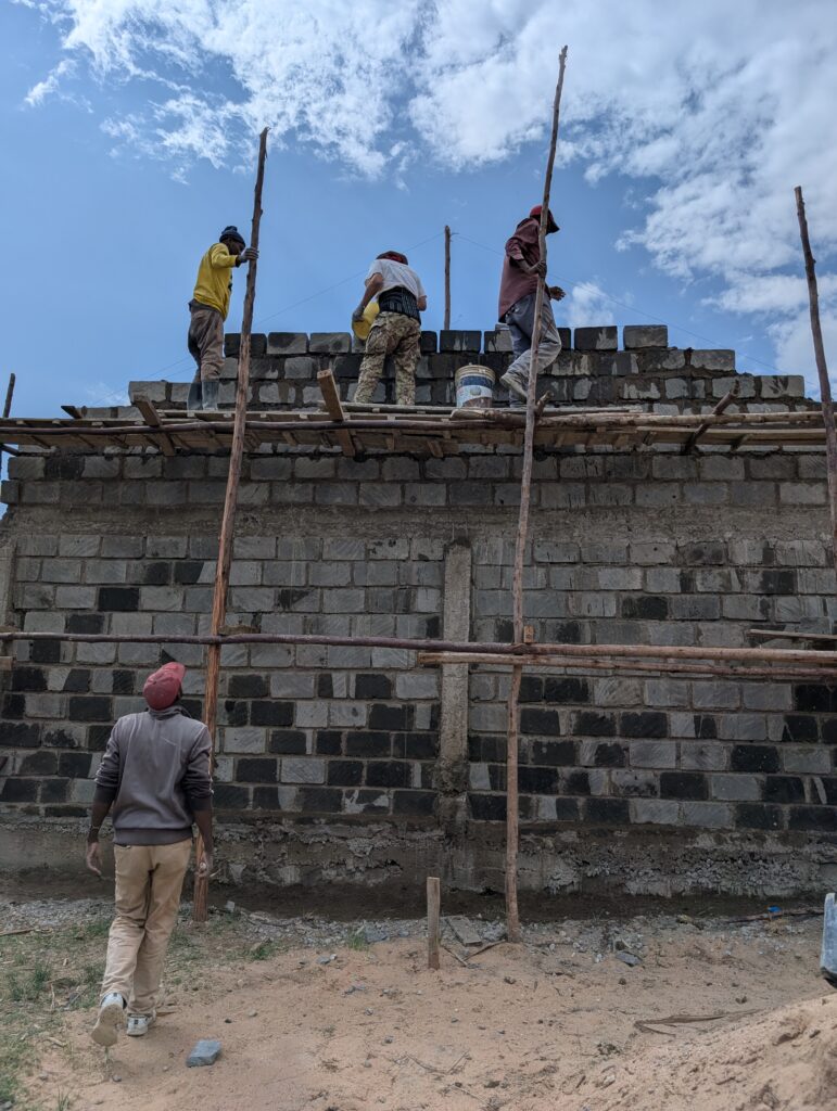 Volunteers working on scaffolding Kenya