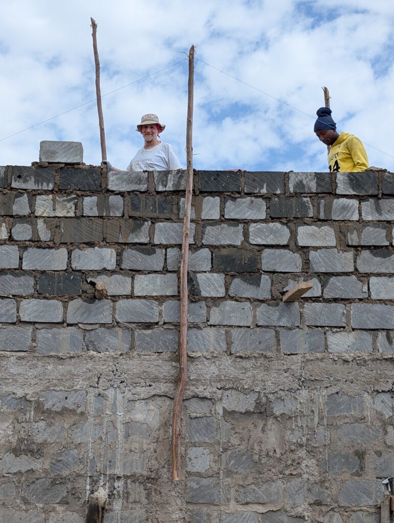 Volunteer standing on wall Kenya