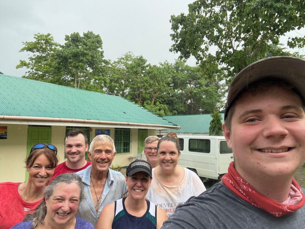 Volunteers in Philippines posing at project site