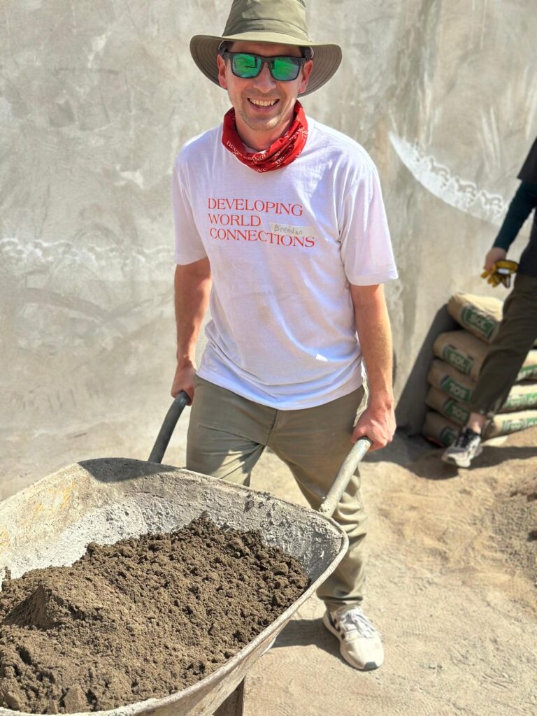 Urban Systems volunteer with wheelbarrow in Peru November 2025