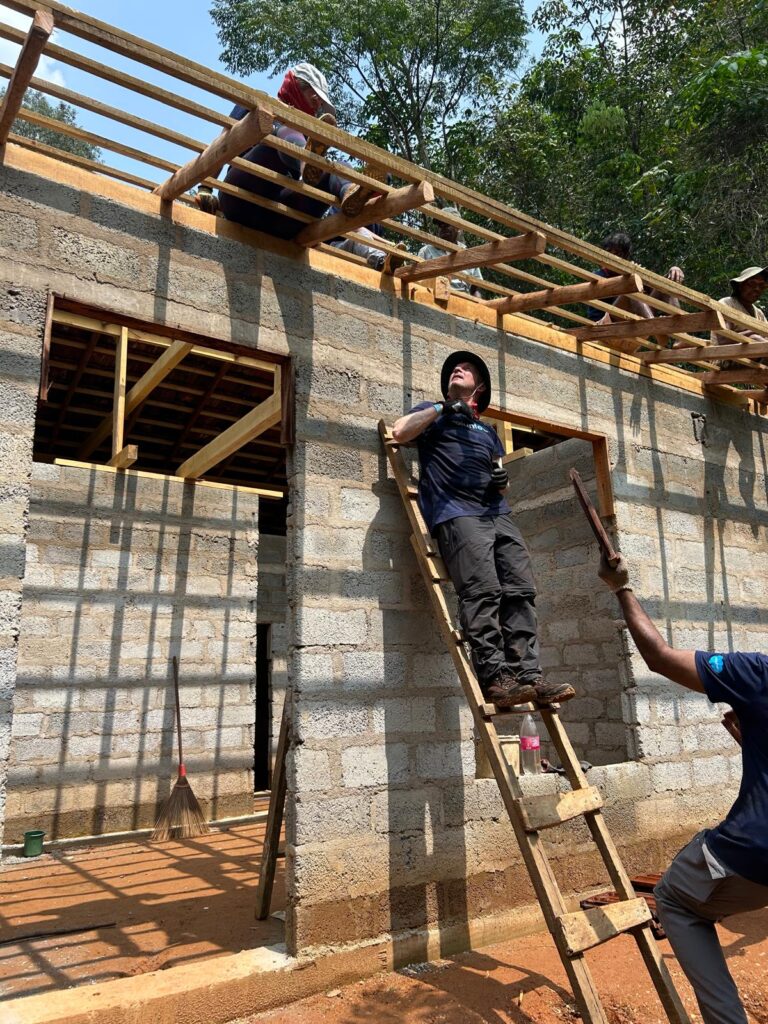 Volunteer on roof Sri Lanka