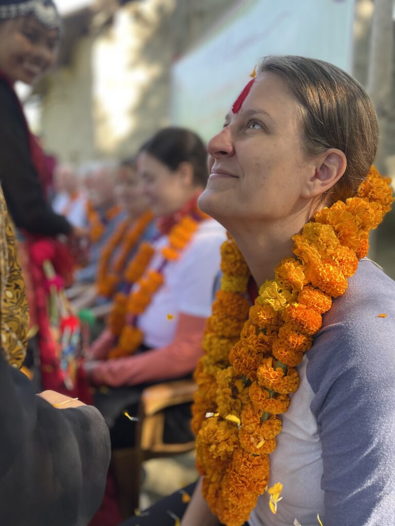 Volunteer wearing mala Nepal