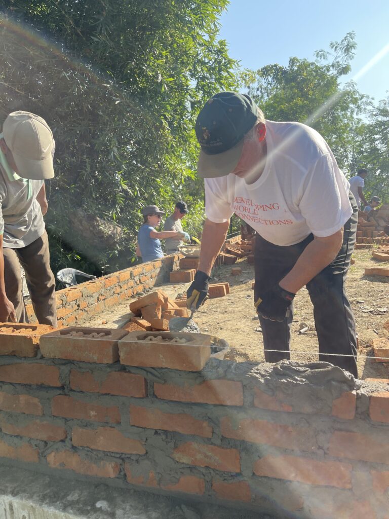 Volunteers laying bricks Nepal