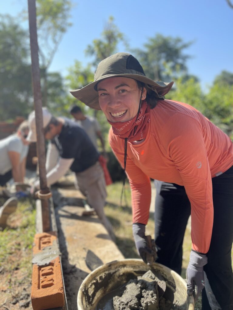 Volunteer mixing cement Nepal