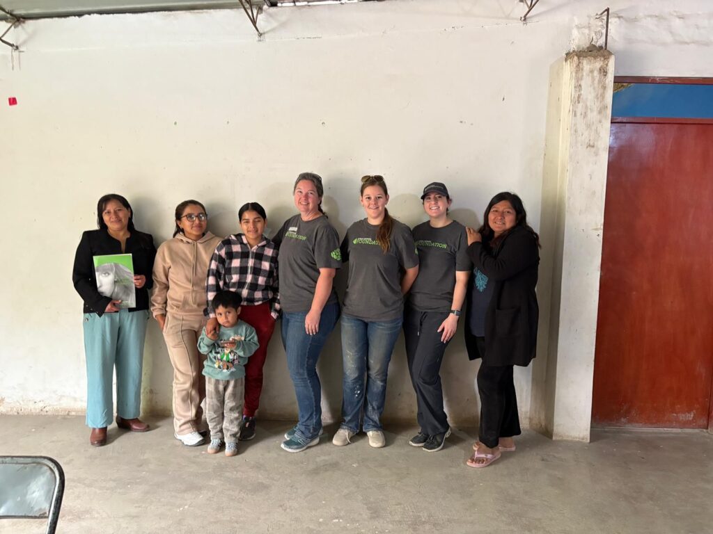 Volunteers with parents and children Peru