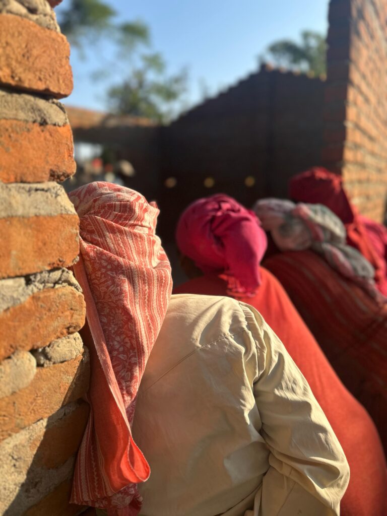 Locals standing in doorway of project Nepal