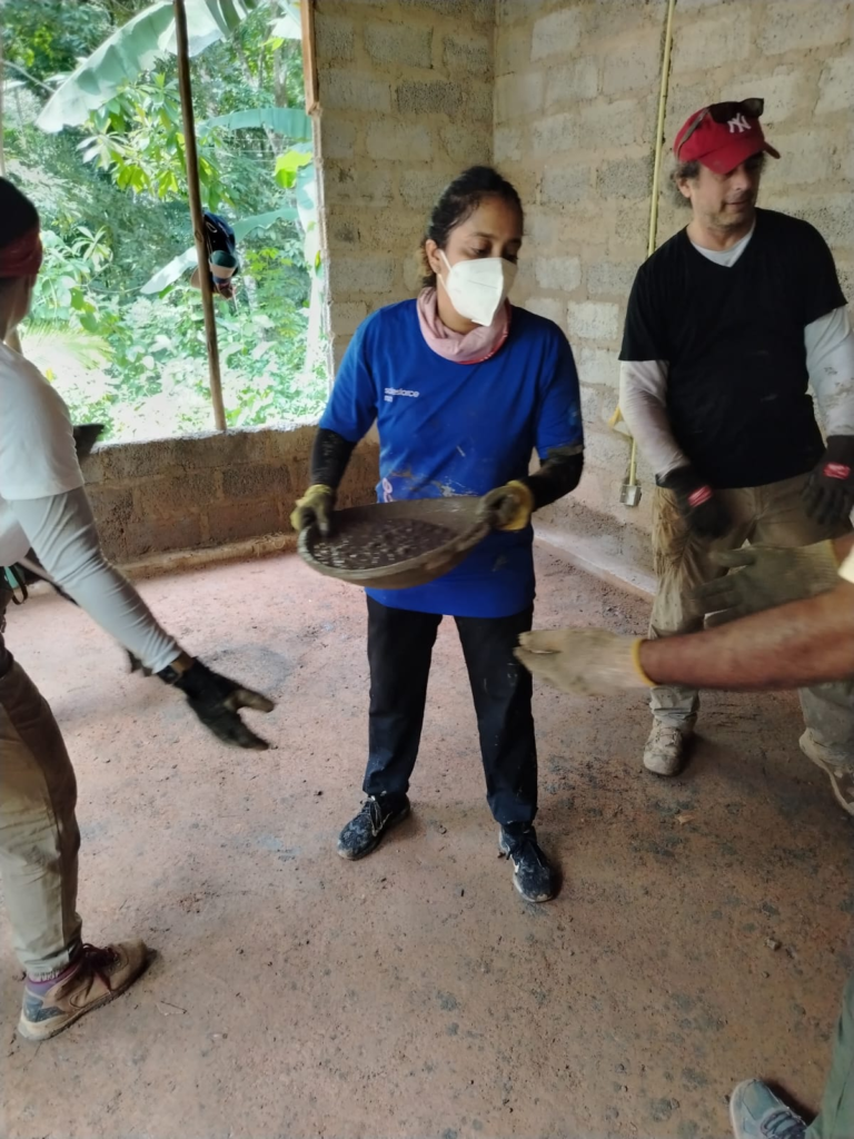 Volunteers in conga line for cement passing in Sri Lanka