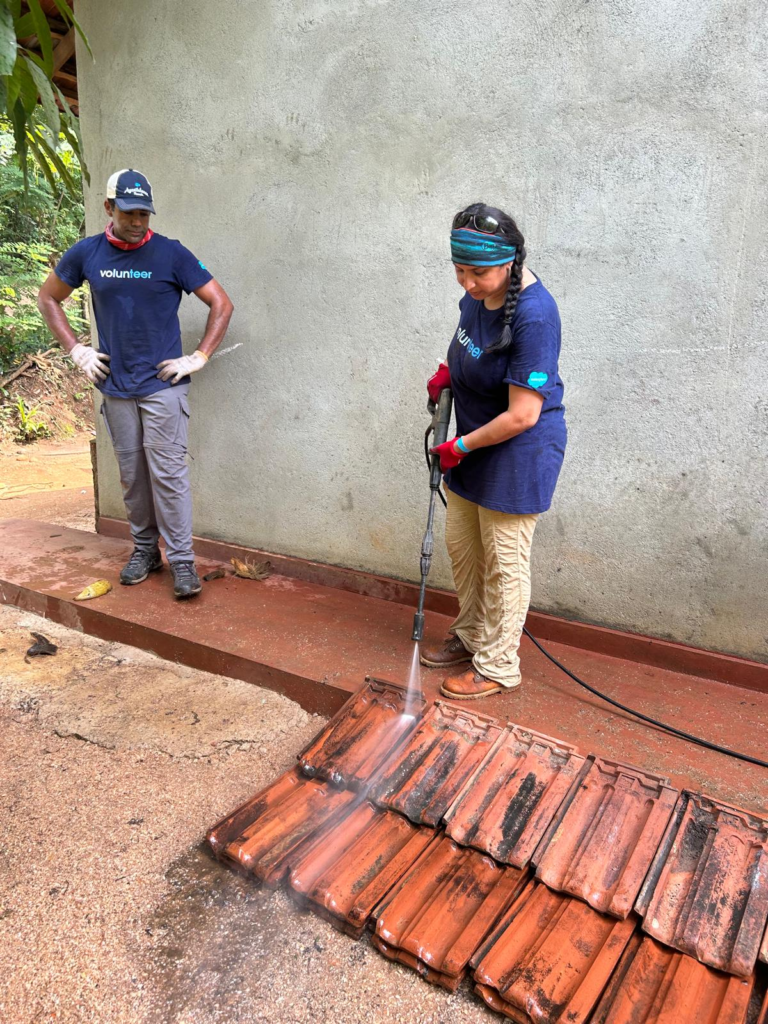 Volunteers washing used roof tiles in Sri Lanka