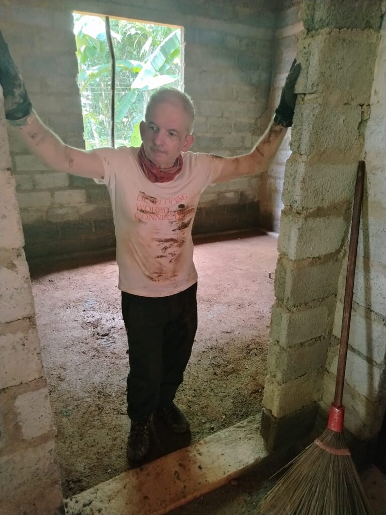 Volunteer in doorway of project site in Sri Lanka