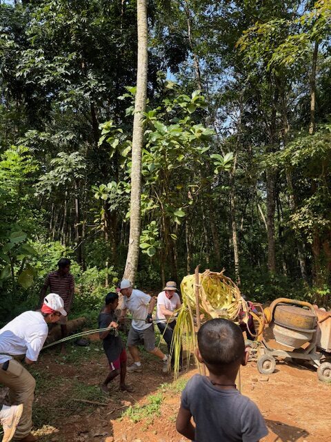 Volunteers using cement mixer Sri Lanka