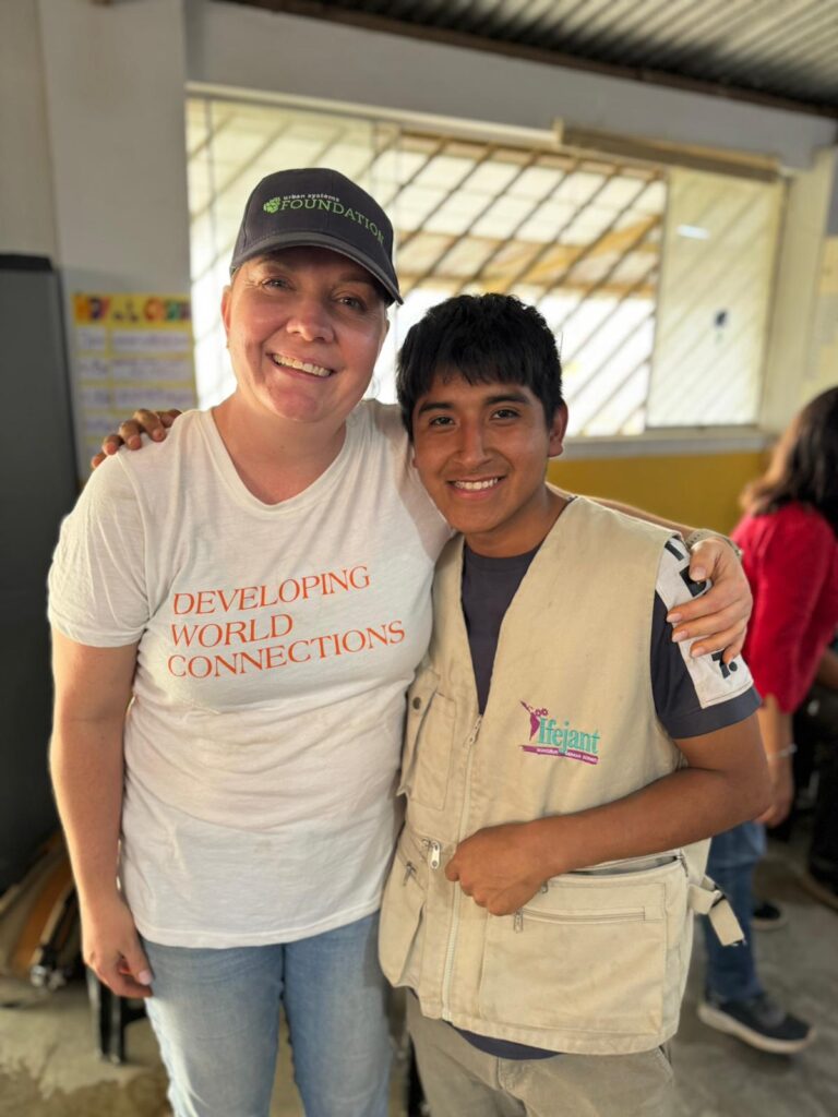 Volunteer posing with local Peru